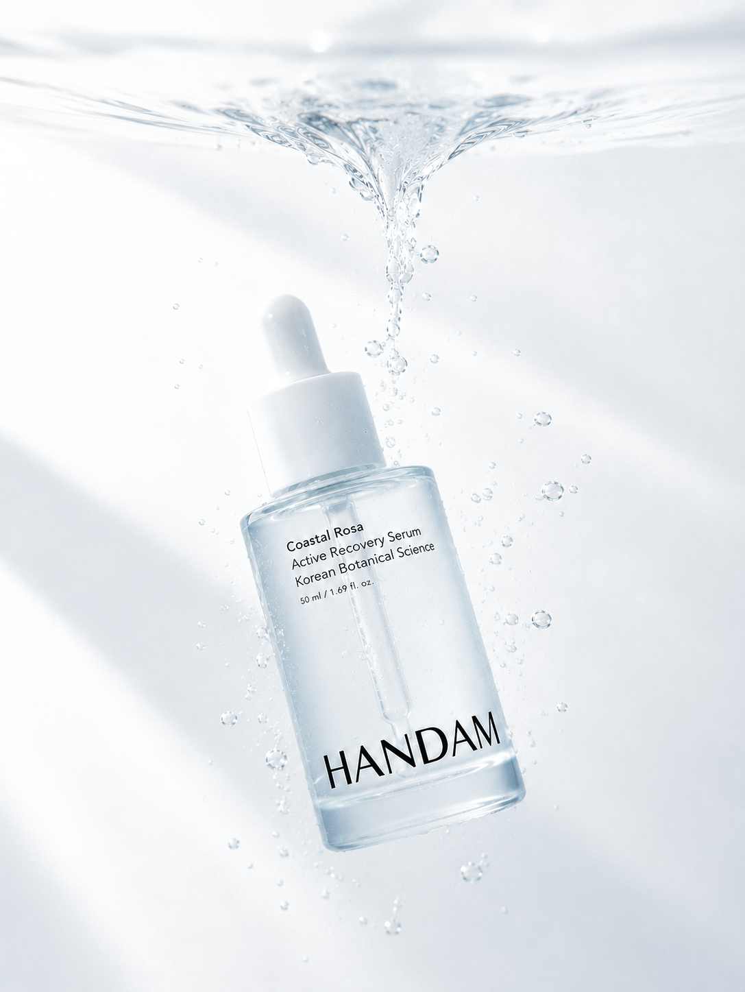 HANDAM Coastal Rosa Active Recovery Serum suspended in water